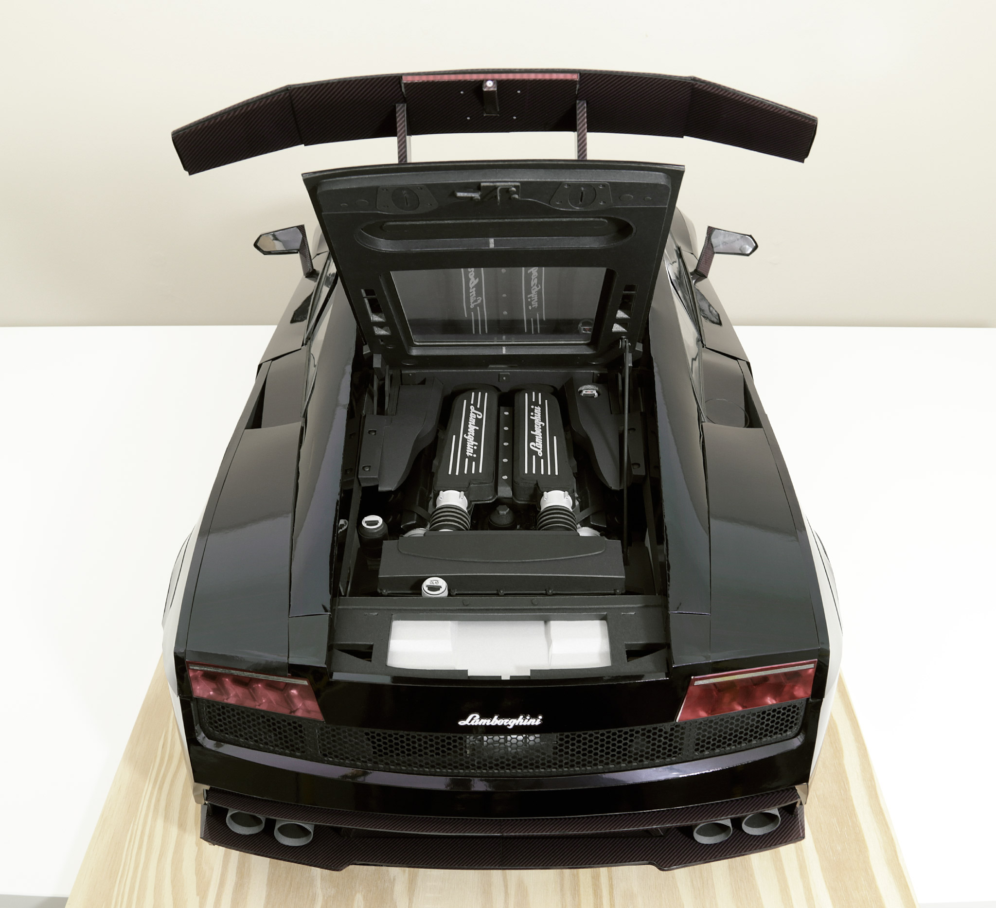 The Gallardo's rear-end, with the engine cover open.